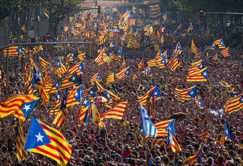 BARCELONA, SPAIN - SEPTEMBER 11:  Demonstrators march during a Pro-Independence demonstration as part of the celebrations of the National Day of Catalonia on September 11, 2014 in Barcelona, Spain. Thousands of Catalans celebrating the 'Diada de Catalunya', are using it as an opportunity to hold demonstrations to demand the right to hold a self-determination referendum next November.  (Photo by David Ramos/Getty Images)