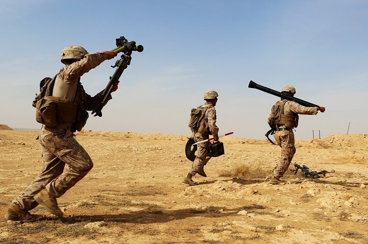 U.S. Marines with Weapons Company, 1st Battalion, 7th Marine Regiment, Special Purpose Marine Air-Ground Task Force--Crisis Response--Central Command, rush with their weapons system as they conduct live-fire training on the new M252A2 81mm mortar system at Al Asad Air Base, Iraq, Oct. 24, 2015.  The training allowed the Marines, who are charged with providing security of Al Asad, an opportunity to hone their tactics, techniques and procedures in employment of the system, further reinforcing their ability to provide protection to their coalition and Iraqi Security Force partners as part of the Combined Joint Task Force – Operation Inherent Resolve’s building partner capacity mission. (U.S. Marine Corps photo by Sgt. Owen Kimbrel/Released)