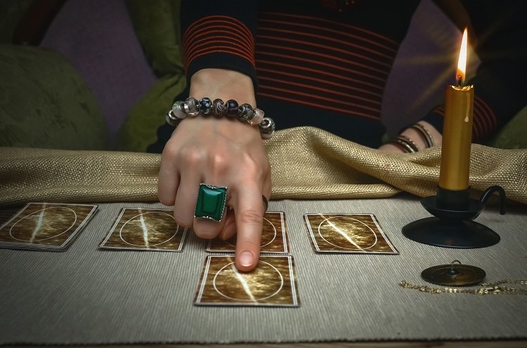 Tarot cards on fortune teller desk table. Future reading.