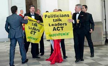 greenpeace activists are led away in copenhagen