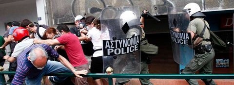 policemen clash with protesters during an anti-austerity rally in athens