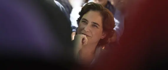 TO GO WITH AFP STORY BY DANIEL BOSQUE - Leader of protest party 'Barcelona en Comu' (Barcelona in Common) and candidate for mayor of Barcelona Ada Colau smiles during a political meeting in Barcelona on May 3, 2015.  Four years ago Spain's "Indignant" protesters were pounding the streets of Barcelona. Now they may soon be walking the corridors of power. Among them is Ada Colau, 41, who is aiming to become Spain's first "Indignant" mayor.  AFP PHOTO/ LLUIS GENE