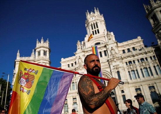 A man holding a flag attends a gay pride parade in downtown Madrid, Spain, July 2, 2016. REUTERS/Andrea Comas