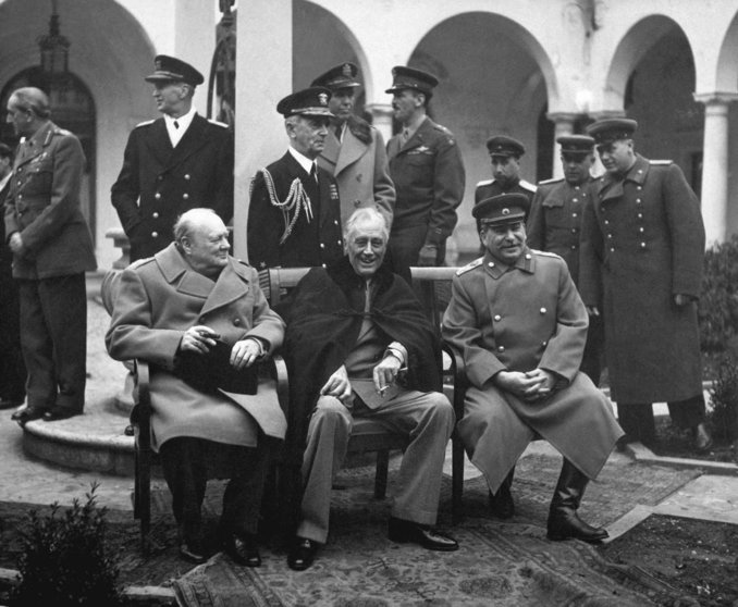 Conference of the Big Three at Yalta makes final plans for the defeat of Germany.  Here the "Big Three" sit on the patio together, Prime Minister Winston S. Churchill, President Franklin D. Roosevelt, and Premier Josef Stalin.  February 1945. (Army)
Exact Date Shot Unknown
NARA FILE #:  111-SC-260486
WAR & CONFLICT BOOK #:  750