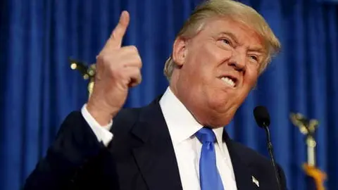 Republican presidential candidate Donald Trump gestures and declares "You're fired!" at a rally in Manchester, New Hampshire, June 17, 2015.  REUTERS/Dominick Reuter      TPX IMAGES OF THE DAY      - RTX1GZCO
