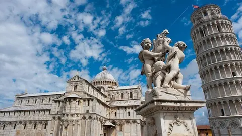 Angels Statue, Pisa Cathedral (Duomo di Pisa) (forefront), The Leaning Tower of Pisa (background), Piazza dei Miracoli ("Square of Miracles"). Pisa, Tuscany, Central Italy.