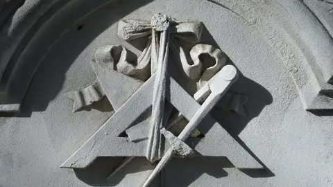 Relief of square & compasses. Detail of Figueroa family's sepulchre (1878) in Almudena Cemetery in Madrid (Spain).