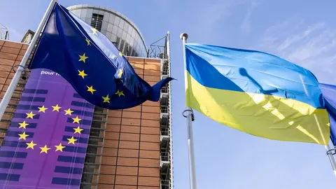 European and Ukrainian flags raised in front of the Berlaymont building to commemorate the third year of the Russian invasion of Ukraine