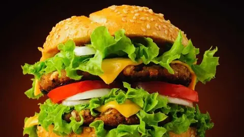 fast food closeup with traditional tasty hamburger